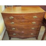 A George III mahogany chest with a D shaped top and four drawers on splayed bracket feet