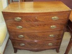 A George III mahogany chest with a D shaped top and four drawers on splayed bracket feet