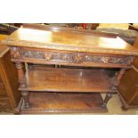 A 19th century Low Countries oak buffet with a rectangular carved top inset with drawers above a