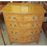 A Georgian style mahogany bow front chest of a small size with four long drawers on splayed feet,