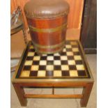 A brass bound oak coal bucket with a pad seat together with a brass bound chess table