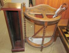 An oak umbrella stand together with a CD rack and four pictures