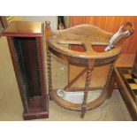 An oak umbrella stand together with a CD rack and four pictures