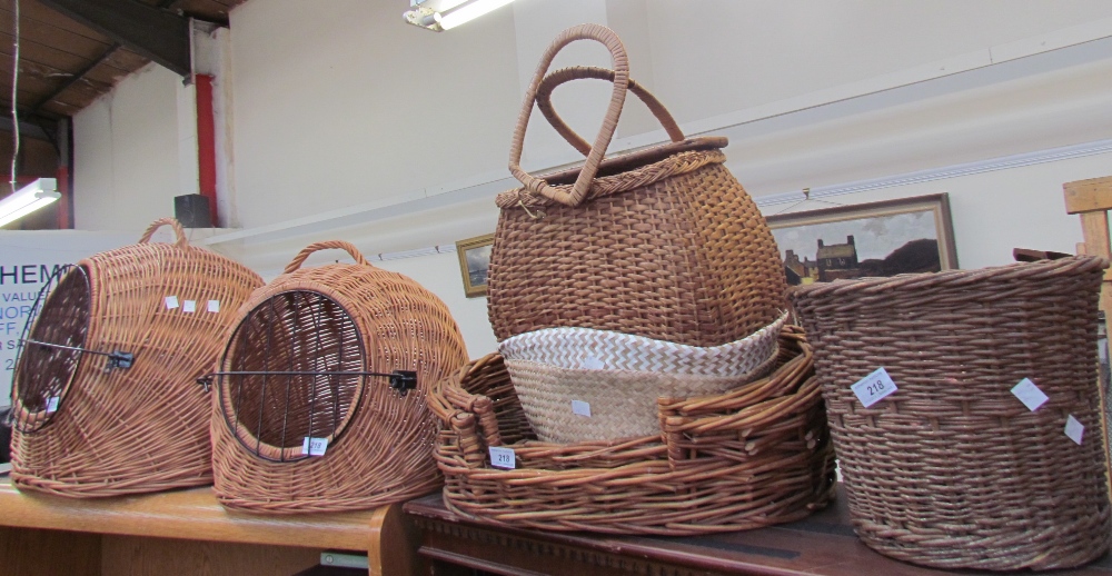 Assorted wicker cat baskets and cat beds