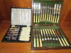 A cased set of twelve electroplated fruit knives and forks together with a cased set of fish knives