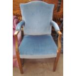 An upholstered George III mahogany elbow chair