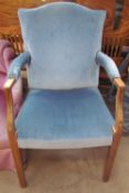 An upholstered George III mahogany elbow chair