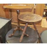 A 20th century mahogany wine table with a shell carved lobed rectangular top on a tapering column