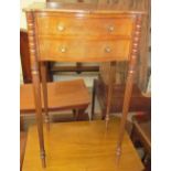 A late 19th century mahogany bedside table of serpentine outline having two drawers on reeded legs,
