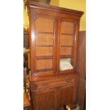 A Victorian mahogany bookcase with a glazed top and cupboard base