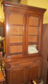 A Victorian mahogany bookcase with a glazed top and cupboard base