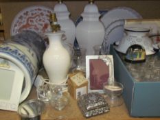 A blue and white pottery umbrella stand together with table lamps, tea lights,