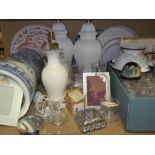 A blue and white pottery umbrella stand together with table lamps, tea lights,