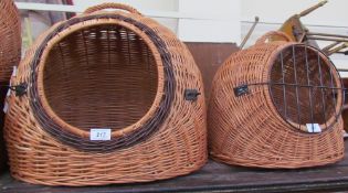 A collection of wicker work cat baskets
