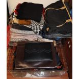 A collection of handbags, scarves,
