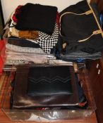 A collection of handbags, scarves,