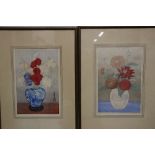 A pair of Japanese woodblock prints of vases of flowers together with a collection of Tin Tin