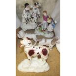 An early 20th century German porcelain figure group of a dog tugging the apron of a girl with