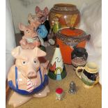 A set of five Wade Natwest piggies together with a Charlotte Rhead geometric pattern vase,