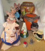 A set of five Wade Natwest piggies together with a Charlotte Rhead geometric pattern vase,