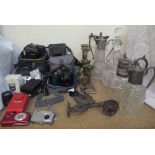 A Nikon Coolpix 8700 camera together with a collection of cameras, brass candlesticks, claret jugs,