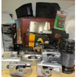 A collection of cameras, together with lenses,
