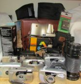 A collection of cameras, together with lenses,