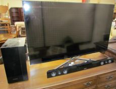 A Samsung UE50F6400AKXXU LED television together with a Samsung HW-F450 sound bar and wireless sub