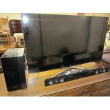 A Samsung UE50F6400AKXXU LED television together with a Samsung HW-F450 sound bar and wireless sub