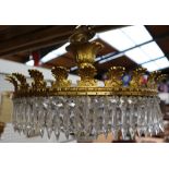 A cut glass and gilt metal ceiling light together with a pair of wall lights