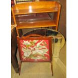 A modern bookcase together with two wall mirrors and a fire screen