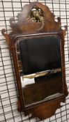 A George III walnut fret carved wall mirror with Hoho bird cresting,