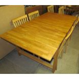 A 20th century light oak extending dining table,