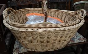 Three wicker baskets and a collection of golf balls