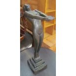 An Art Deco style plaster figure of a maiden on a stepped square base