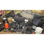 Assorted camera equipment including Portaflash equipment, lenses,