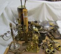 An electroplated menorah together with a brass example, brass candlesticks, fire irons,