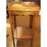 A George III mahogany night table with pull out slide