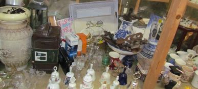 Assorted porcelain bells together with drinking glasses, costume jewellery, love spoons,