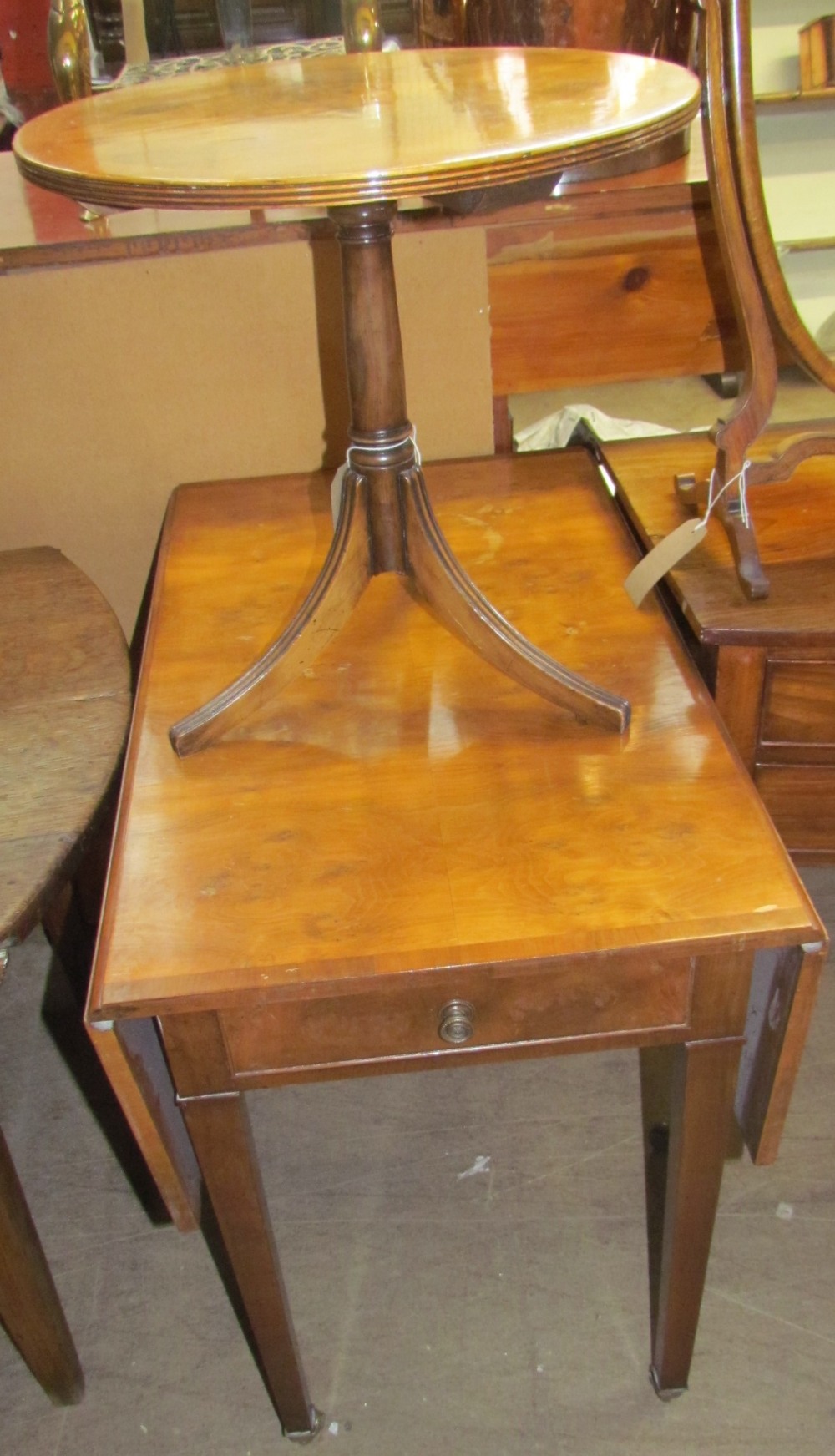 A 20th century yew wood Pembroke table with rectangular cross-banded top above an end frieze drawer