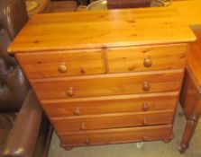 A modern pine chest with two short and four long drawers