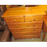 A modern pine chest with two short and four long drawers