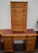A 20th century pine desk together with a pine chest of drawers