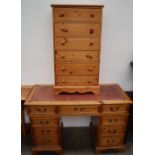 A 20th century pine desk together with a pine chest of drawers