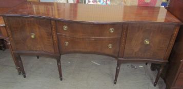 A Regency style mahogany sideboard with cupboards and drawers