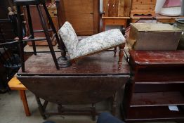 A 19th century oak gate leg dining table together with a reproduction mahogany bookcase,