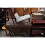 A 19th century oak gate leg dining table together with a reproduction mahogany bookcase,