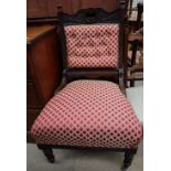 An Edwardian carved and upholstered lady's chair