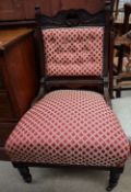 An Edwardian carved and upholstered lady's chair