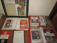 Two albums of Man United programmes together with Welsh programmes and framed picture